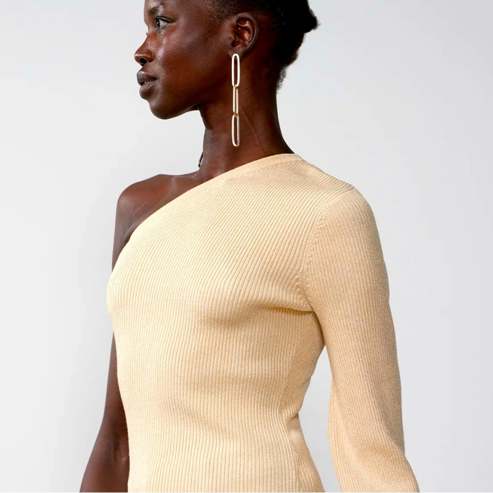 Shimmer & shine. Sophistication. Sultry. One shoulder long sleeve sweater.
